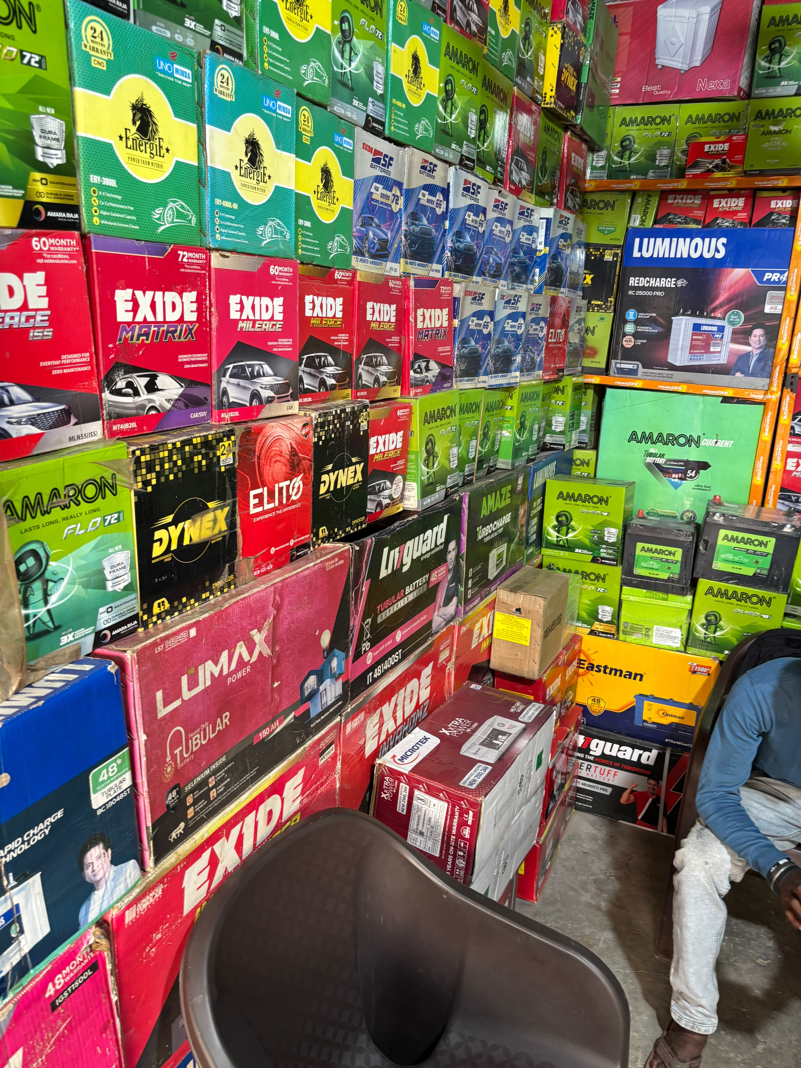 Inside Shree Battery Store near Yatharth Hospital Greater Noida showing ready stock of Exide, Amaron, Luminous and Livguard batteries